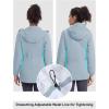 imageTBMPOY Womens Lightweight Rain Long Jackets Packable with Hooded Outdoor Hiking Waterproof Windbreaker Raincoats TravelLight Blue